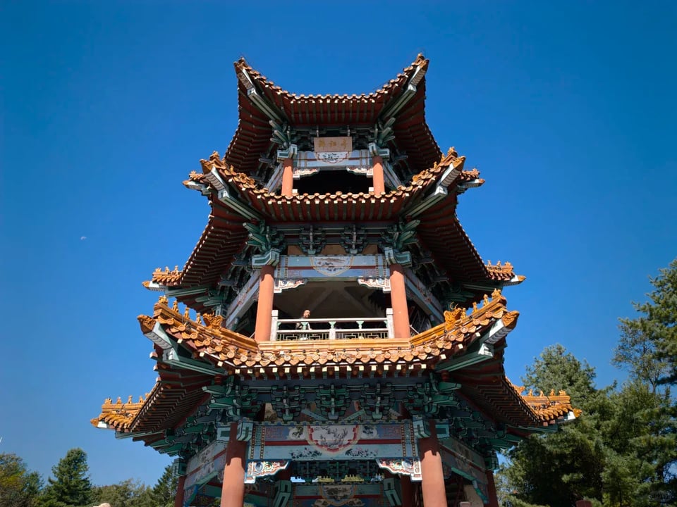 A traditional multi-level pavilion with ornate curved roofs.