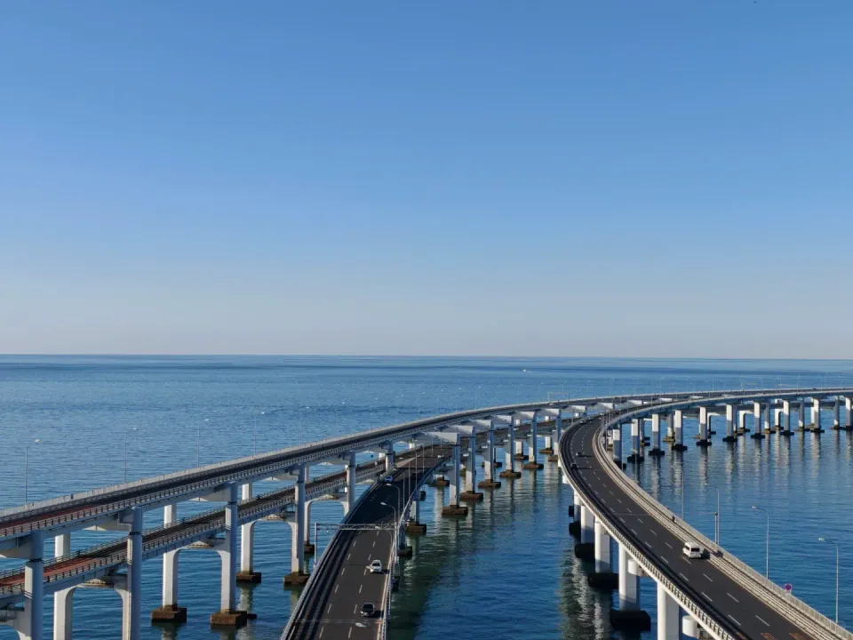 Elevated view of the curved roadways of Dalian's sea bridge.