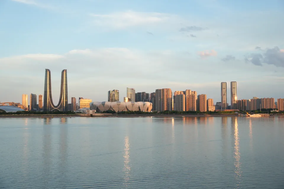 Hangzhou Olympic Sports Center skyline reflected in the river