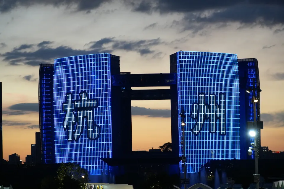 Blue light show across the facade of Hangzhou Civic Center