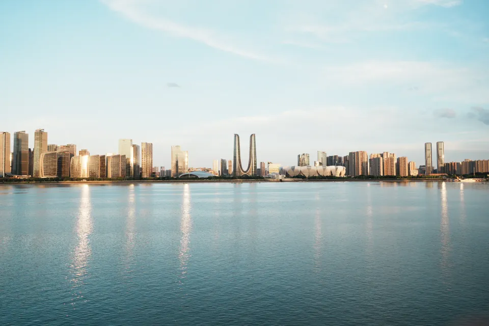 Hangzhou skyline across the Qiantang River in evening light