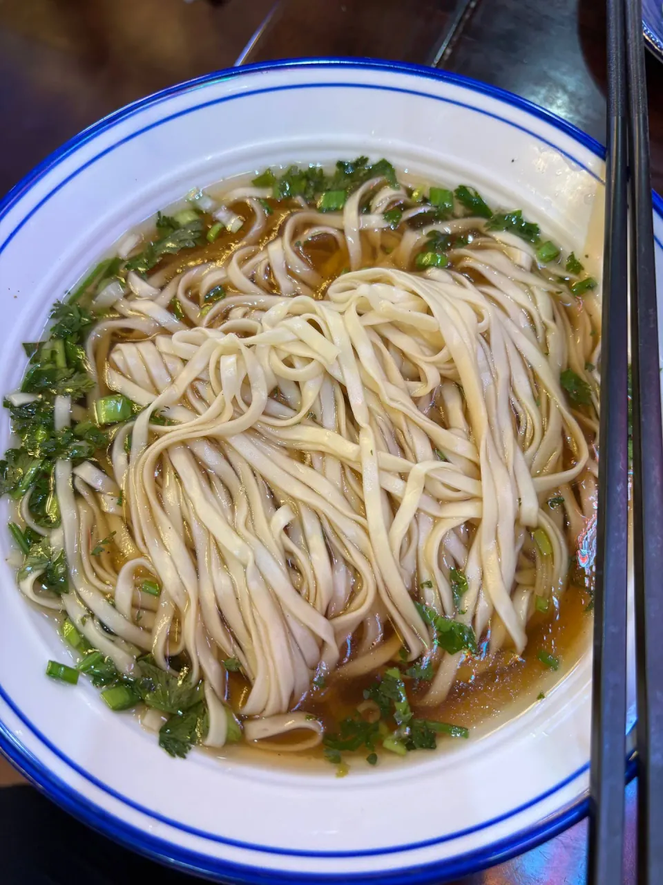 Bowl of thin noodles in clear broth