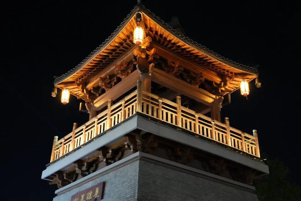 Traditional tower illuminated at night