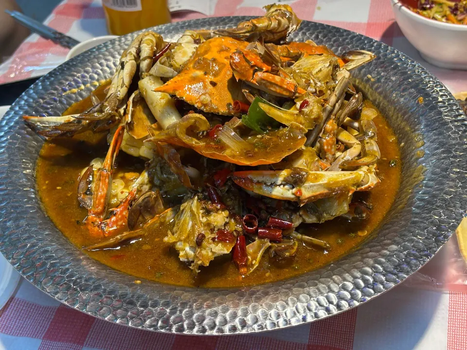 Spicy crab served in a glass bowl
