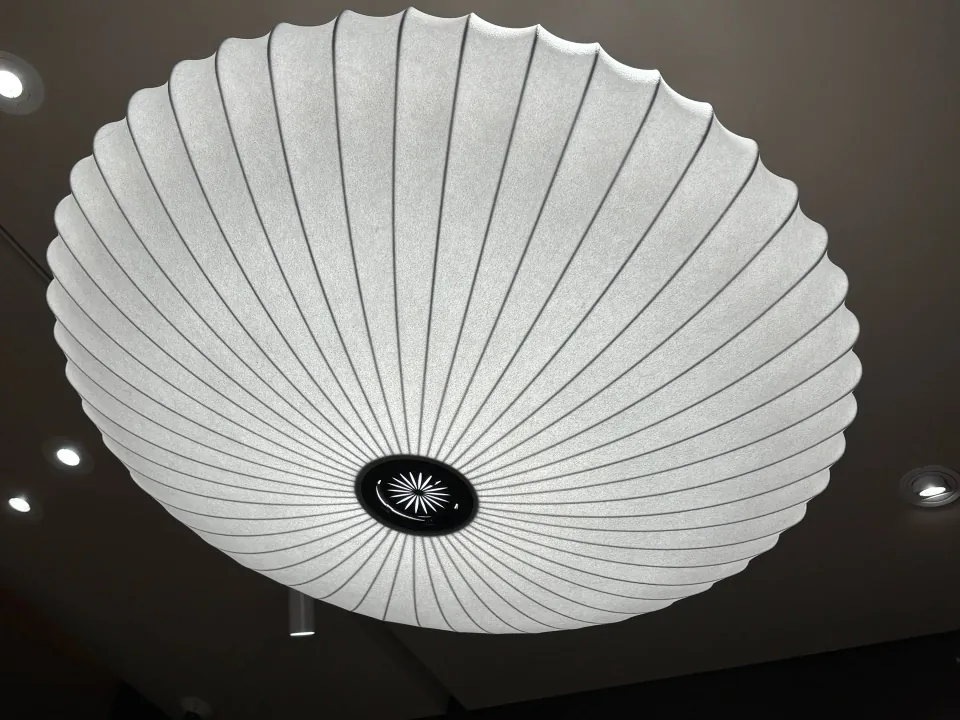 Large pleated ceiling light inside the Starbucks