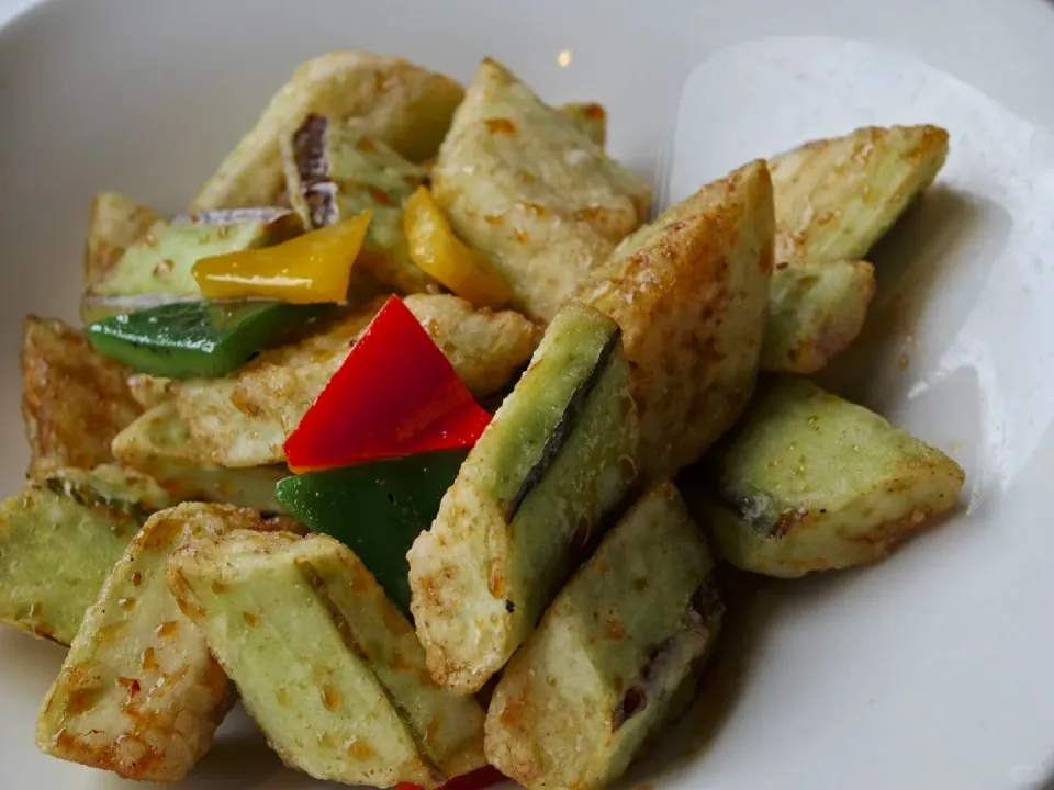 Fried vegetable pieces tossed with green and red peppers.